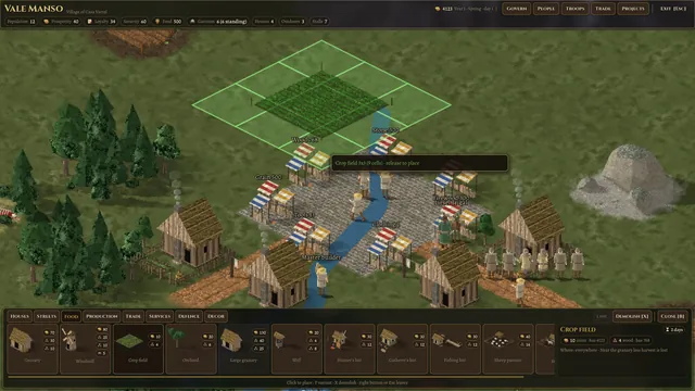 The village by the river with a field being dragged out and the build palette open
